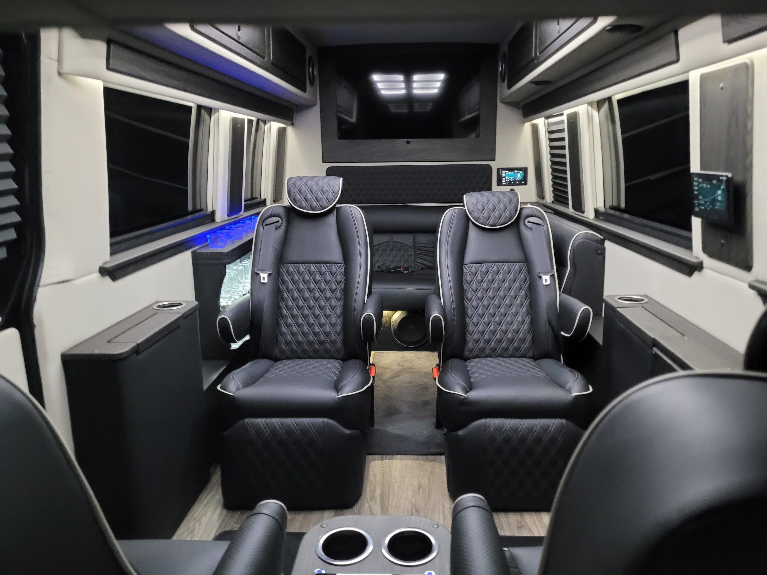 Luxurious black leather seats inside a spacious vehicle interior.